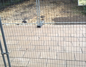 Block paving with protective fence